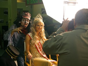 Dressed as St. Thomas Tom Zombie Festival's first Tom Zombie, Hamilton actor John Migliore menaces St. Thomas beauty queen Kristen McCord after Migliore was introduced at a photo op. 

File photo