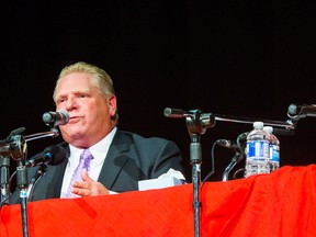 Mayoral candidates Doug Ford (left) and John Tory at York Memorial Collegiate Institute for the York South-Weston mayoral candidates debate  in Toronto on Tuesday Sept. 23, 2014. (ERNEST DOROSZUK/Toronto Sun)