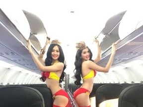 A budget Vietnamese airline says photos of flight attendants in lingerie were leaked from a test shooting and spread online, but are not official promotional photos. (Facebook)