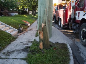 London Hydro crews were busy replacing a pole on Wellington Rd. at Whetter Rd. that was damaged when it was struck by a vehicle in early this morning in London. A passenger in the vehicle was ejected and killed. DEREK RUTTAN/ The London Free Press /QMI AGENCY