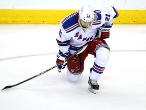 Derek Stepan #21 of the New York Rangers looks down in the first period while taking on the Los Angeles Kings during Game Five of the 2014 Stanley Cup Final at Staples Center on June 13, 2014 in Los Angeles, California.  (Bruce Bennett/Getty Images/AFP)
