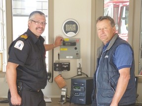 Acting fire chief, Dave Renner, and Mayor Jim Ginn practice using the emergency alert siren at the Central Huron Fire Department last Thursday afternoon.