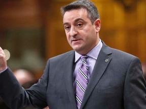 Parliamentary Secretary to the Prime Minister, Paul Calandra speaks during Question Period in the House of Commons on Parliament Hill in Ottawa November 18, 2013. REUTERS/Chris Wattie