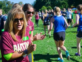 Pat Foto, mom of Alexandra Foto, and Banting cross country coach Becky Wright cheer on runners at Springbank Park in London on Wednesday. 
Mike Hensen/The London Free Press/QMI Agency