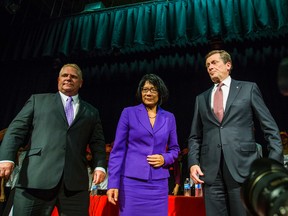 Mayoral candidates -- Doug Ford, Olivia Chow and John Tory pose for a photo after the debate York Memorial Collegiate Institute on Sept. 23, 2014. (Ernest Doroszuk/Toronto Sun)