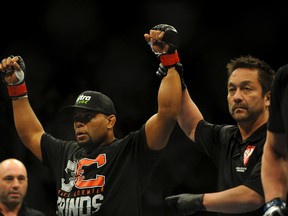 Daniel Cormier celebrates his victory of Pactrick Cummins after their UFC light heavyweight bout at Mandalay Bay on February 22, 2014.(Stephen R. Sylvanie/USA TODAY Sports)