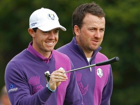 European Ryder Cup players Rory McIlroy and Graeme McDowell walk off the 17th tee during practice at Gleneagles in Scotland on September 24, 2014. (REUTERS/Phil Noble)