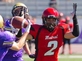 Kale Pow of Central intercepts a pass intended for Zane Helmi of the Saunders Sabres during their TVRA United Way game at TD Stadium on Wednesday. The Golden Ghosts won 30-14. (Mike Hensen/The London Free Press)