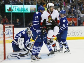 Ottawa Senators forward Mika Zibanejad (93) jumps out of the way of a shot on Toronto Maple Leafs goaltender James Reimer (34) as defensemen Jake Gardiner (51) and forward Petri Kontiola (15) defend during the first period at the Air Canada Centre. (John E. Sokolowski-USA TODAY Sports)