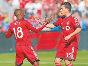 Toronto FC forward Jermain Defoe celebrates one of his 12 goals this season with midfielder Daneil Lovitz. (USA TODAY SPORTS)