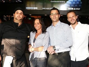 Gino Donato/The Sudbury Star
Jesse Martel, owner and general manager of Shoeless Joe's Sport Grill, second from right, and his staff, kitchen manager Phil Mongrain, bar manager, Danica McCulloch and manager Ryley Bryson, show off the bar area of the new restaurant in the south end. The establishment opens for business on Monday.