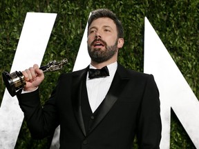 Ben Affleck holds his best picture award for his film "Argo" at the 2013 Vanity Fair Oscars Party in West Hollywood, California in this file photo taken February 25, 2013. REUTERS/Danny Moloshok/Files