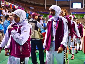 Qatar's women's basketball team leaves the court after forfeiting their women's basketball game against Mongolia at Hwaseong Sports Complex during the 17th Asian Games in Incheon September 24, 2014. (REUTERS/Kim Kyung-Min/Sports Chosun)