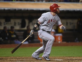 Los Angeles Angels left fielder Josh Hamilton (32) hits a solo home run against the Oakland Athletics during the fourth inning at O.co Coliseum. (Kyle Terada-USA TODAY Sports)