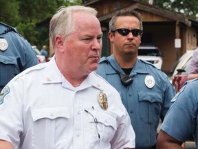 Ferguson Police Chief Thomas Jackson (C) walks away from a media availability regarding his office's handling of the release of information following the shooting of Michael Brown in Ferguson, Missouri August 15, 2014.   REUTERS/Lucas Jackson