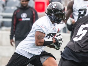 Jeremiah Johnson runs with the ball during practice at TD Place on Wednesday. (Errol McGihon/Ottawa Sun)