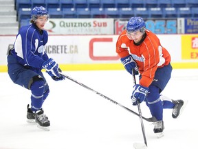 Sudbury Wolves winger Nathan Pancel, right, skates past defenceman Evan de Haan during team practice Tuesday afternoon. The wolves open up their regular season on Friday night with a game against the Niagara IceDogs at the Sudbury Community Arena, game time is 7:30 p.m.