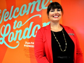 Andrea McNaughton, executive director of the London Heritage Council, stands next to one of the new displays at the London International Airport September 25, 2014. CHRIS MONTANINI\LONDONER\QMI AGENCY