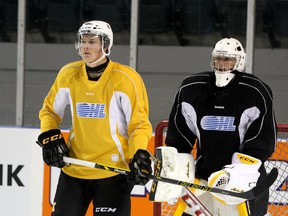 Forward Lawson Crouse stands in front of goalie Jeremy Helvig during a Kingston Frontenacs practice at the Rogers K-Rock Centre on Wednesday. (Ian MacAlpine/The Whig-Standard)