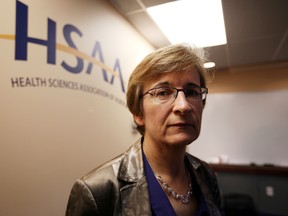 Health Sciences Association of Alberta President Elisabeth Ballermann speaks to the media about the conditions of Emergency Meidical Services members' working condition during a news conference at their offices in Edmonton, Alberta on September 25, 2014.. Perry Mah/Edmonton Sun