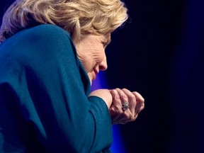 Former U.S. Secretary of State Hillary Clinton ducks as an object was thrown on stage during her speech to members of the Institute of Scrap Recycling Industries in Las Vegas, Nevada, April 10, 2014. A woman threw a shoe at Clinton as the former secretary of state was delivering a speech at a Las Vegas hotel, but Clinton dodged it and continued with her remarks.
REUTERS/Las Vegas Sun/Steve Marcus