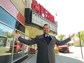 Brian Austin Jr., manager of the Imperial Theatre in downtown Sarnia, stands beneath the marquee where new LED signs were being installed Thursday. The project, funded with a $60,000 donation by Imperial Oil, was expected to be completed in time for the new signs to be officially turned on Friday afternoon. (PAUL MORDEN/THE OBSERVER/QMI AGENCY​)