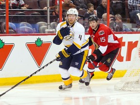 Nashville Predators defenseman Ryan Ellis (4) skates with the puck with Ottawa Senators center Zack Smith (15) chasing in the second period at the Canadian Tire Centre. (Marc DesRosiers-USA TODAY Sports)