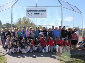 Family, friends, ballplayers and members of Spruce Grove city council celebrated with Gord and Jane Montgomery (middle) after the Woodhaven field in Spruce Grove was officially renamed Gord Montgomery Field on Sept. 21. Recently retired after 30 years of sports reporting in the tri-area, Gord Montgomery was stood overwhelmed and surprised by this incredible honour. Congratulations Gord! - Karen Haynes, Reporter/Examiner