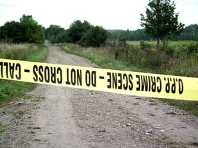 Police tape blocks a road into the Hullett Provincial Wildlife Centre. (File shot)
