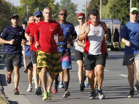 The National Peace Officers’ Memorial Run to Remember passed through Belleville, Ont. Friday morning, Sept. 26, 2014 when a group of police officers from the Greater Toronto Area ran from Cobourg, Ont. to Brockville, Ont. on the second day of the three-day event. - JEROME LESSARD/THE INTELLIGENCER/QMI AGENCY