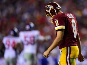 Quarterback Kirk Cousins #8 of the Washington Redskins walks off the field after throwing an interception. (Patrick Smith/Getty Images/AFP)