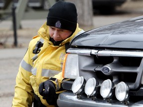 Police investigate at the scene of a car/pedestrian accident at the 95 Avenue and 92 Street intersection, in Edmonton Alta., on Wednesday April 16, 2014. David Bloom/Edmonton Sun