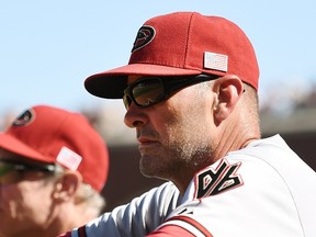 Manager Kirk Gibson #23 of the Arizona Diamondbacks looks on from the dugout. (Thearon W. Henderson/Getty Images/AFP)