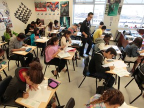 Longfields-Davidson Heights SS in Ottawa, On. Friday Sept 26,  2014. Longfields-Davidson Heights SS ranked very high in math among Ottawa schools. Here math teacher Mike Czudner works with his students. 
Tony Caldwell/Ottawa Sun/QMI Agency