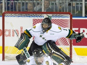 London goalie Tyler Parsons watches Knights defenceman Julius Bergman block a shot during their OHL regular season home opener against the Plymouth Whalers at Budweiser Gardens on Friday night. The Knights lost 5-0. (Craig Glover/London Free Press)