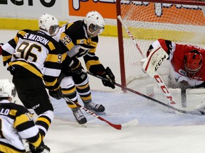 Kingston Frontenacs Juho Lammikko (82) and Spencer Watson get a shot on Ottawa 67's goalie Leo Lazarev during Ontario Hockey League action at the Rogers K-Rock Centre on Friday night. Kingston won 3-1. (Ian MacAlpine/The Whig-Standard)
