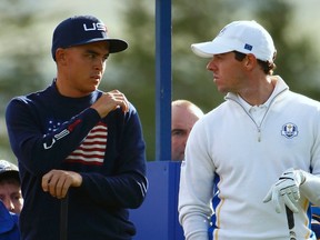 U.S. Ryder Cup player Rickie Fowler (L) and European Ryder Cup player Rory McIlroy wait on the 12th tee during their fourballs 40th Ryder Cup match at Gleneagles in Scotland Sept. 27, 2014. (REUTERS/Eddie Keogh)
