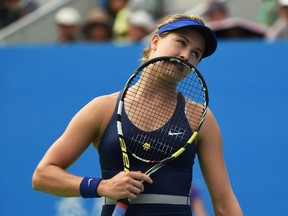 Eugenie Bouchard of Canada reacts after losing a point to Petra Kvitova of the Czech Republic during the final of the Wuhan Open tennis tournament on September 27, 2014. (AFP PHOTO/Greg BAKER)