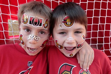 The Ottawa Senators held their Fan Fest at Scotiabank Place in Ottawa, On. Saturday Sept 27,  2014. Thousands of fans gathered to enjoy the festivities as well as take in a practice and a scrimmage Saturday. Sam and Isaac were ready to cheer on their team Saturday. Tony Caldwell/Ottawa Sun/QMI Agency