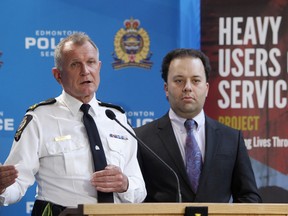 Edmonton Police Chief Rod Knecht and Minister of Justice and Solicitor General Jonathan Denis speak to the media about the Heavy Users of Services project, during a press conference at police headquarters, in Edmonton Alta., on Thursday May 1, 2014. The initiative will use proceeds of crime funds to make communities safer. David Bloom/Edmonton Sun/QMI Agency