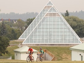 Bad, smoky air is seen from a park near the Muttart Conservatory in Edmonton, Alta., on Wednesday, July 16, 2014. Air quality warnings were issued throughout the day, as smoky air from area wildfires drifted over the city. Ian Kucerak/Edmonton Sun/QMI Agency