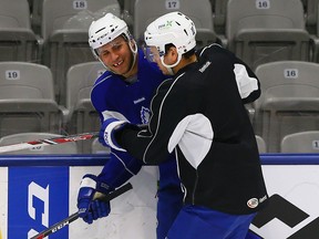 Defenceman Stuart Percy (right) said "I'm still here" on Saturday when asked to assess his training camp performance. (Dave Abel/Toronto Sun)
