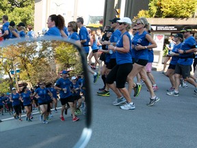 Hundreds of Police officers from across Canada along with some family and friends run up Elgin Street on Saturday Sept 27, 2014. The National Peace Officer’s Memorial Run was established in 2005 when the Peel Regional Police running team, The Pacers, decided to raise awareness of the annual Police and Peace Officer’s Memorial Service held annually on Parliament Hill. The service will be held Sunday, Sept. 28, 2014. 
Tony Caldwell/Ottawa Sun/QMI Agency