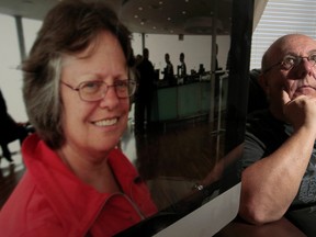 Brian Larue poses for a photo near a photo of his wife Ginette in Ottawa, On. Friday Sept 26,  2014. Brian's world has been turned upside down since his wife was diagnosed with severe mental illness.  
Tony Caldwell/Ottawa Sun/QMI Agency