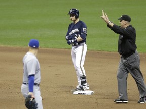 Jonathan Lucroy #20 of the Milwaukee Brewers stands at second base after hitting his 53 double for the season during the bottom of the fifth inning against the Chicago Cubs at Miller Park on September 27, 2014 in Milwaukee, Wisconsin. (Mike McGinnis/Getty Images/AFP)