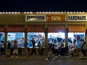 Protesters march during a rally in Ferguson, Missouri, September 26, 2014.  REUTERS/Whitney Curtis