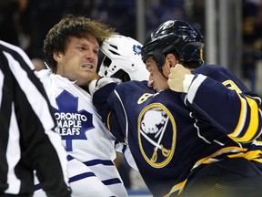Buffalo Sabres centre Cody McCormick (8) punches Toronto Maple Leafs right wing David Clarkson (71) in a fight during the third period at First Niagara Center Sept. 26, 2014. Leafs beat the Sabres 6-4. (Kevin Hoffman-USA TODAY Sports)