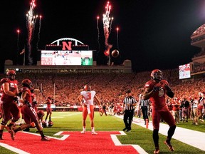 Running back Ameer Abdullah (8) of the Nebraska Cornhuskers celebrates a touchdown during their game at against the Illinois Fighting Illini at Memorial Stadium on September 27, 2014 in Lincoln, Nebraska. The stadium has been home to 337 straight sellouts and one of the most devout fan bases in all of sports (Eric Francis/Getty Images/AFP)