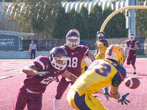Queen's Golden Gaels' Doug Corby picks up Queen's second TD of the game in Hamilton on Saturday. (Jeff Chan/For The Whig-Standard)