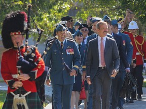 Chief of Defence Staff Gen. Thomas Lawson, left, and Col. Chris Hadfield lead in the special guests to the 2014 Wall of Honour ceremony at Royal Military College on Saturday. (Julia McKay/The Whig-Standard)